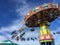 Flying swing carnival rides at a local street fair