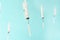 Flying syringes on blue background. Medical concept of mass vaccination of people, population for covid-19 coronavirus, flu,