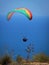 Flying tandem paragliders in the sky over the sea and near the mountains, beautiful sea view 01