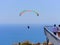 Flying tandem paragliders in the sky over the sea and near the mountains, beautiful sea view 05