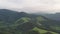 Flying to the mountain, aerial view of green forest