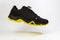 Flying touristic waterproof black and yellow man shoe from side on white background