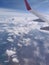 Flying and traveling, view from airplane window on the wing