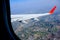 Flying and traveling, view from airplane window on the wing