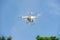 Flying unmanned quadcopter with video camera