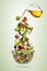 Flying vegetable greek salad isolated on gradient background.