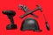 Flying view of monochrome construction tools for repair on red background