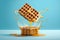 Flying waffles and butter getting dripped with maple syrup over a light blue background. AI generated