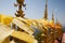 Flying and waving yellow and orange buddhist flags in thai temple with sky background