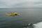 Flying yellow helicopter of Columbia River Bar Pilots ready for embarking and  transferring  pilots