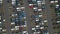 Flyover drone view top down on parked cars ready for shipping distribution turning in a circle