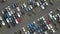 Flyover drone view top down on parked cars ready for shipping distribution turning in a circle