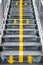 Flyover stairs with up and down yellow arrows separated by line.