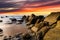 Flysch rocks in Barrika beach at the sunset. Travel in Spain.