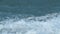 Foam Blue And Green Waves On Gray Sand. Choppy Sea Captured With Telephoto Lens. Rough Sea With Storm. Real time.