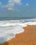 The foam and bubbles washed by the gentle waves at Goa Calungute beach