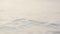 Foamy Mediterranean waves rolling to the sandy beach. Beautiful Turkish nature. Close-up shot of calming water.