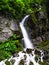 Foamy Valley Waterfall in Bucegi mountains accessible from Busteni town. Long exposure picture of a waterfall