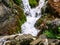 Foamy Valley Waterfall in Bucegi mountains accessible from Busteni town. Long exposure picture of a waterfall
