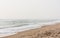 Foamy water on calm beach