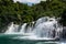 Foamy waterfall rapids falling down by cascades of waterfall Skradinski Buk, Croatia.