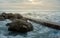 Foamy waves crash on rocky shore. Creative Sea Ocean Landscape Concept