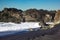 Foamy waves rushing into the scenic shore with huge cliffs