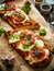 Focaccia - roasted sandwiches with mozzarella and tomatoes on wooden background