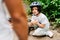 Focus of boy fell from bicycle and looking at father while dad standing near son