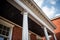 focus on the deep eaves on a brick italianate building