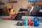 Focus on fitness equipments, barbell and kettlebell. Woman doing sit-ups in the background. Concepts about home workout, fitness,