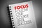 FOCUS - Follow One Course Until Success acronym on notepad, business concept background