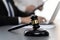 Focus gavel with blur lawyer colleagues working at law firm. Equilibrium