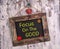 Focus on the good written on Vintage sign board