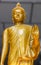 Focus on hand Yellow image of buddha standing