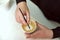 Focus on the hands of baristas while making a latte. Barista draws coffee