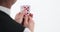 Focus on the hands with cards of a poker player, royal flush - close-up, royal flush in hand