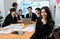 Focus portrait of asian female manger with blurred background in harmony.