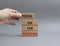 Focus on the Positives symbol. Concept word Focus on the Positives on wooden blocks. Beautiful grey background. Businessman hand.