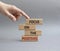 Focus on the Positives symbol. Concept word Focus on the Positives on wooden blocks. Beautiful grey background. Businessman hand.