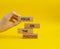 Focus on the Positives symbol. Concept word Focus on the Positives on wooden blocks. Beautiful yellow background. Businessman hand