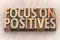 Focus on positives - word abstract in wood type