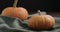 Focus pull between two pumpkins on linen cloth