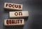 Focus on Quality words of on wooden blocks. Honesty in business concept