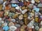 A Focus Stacked Image of a Variety of Tumbled Rocks to include turquise, amethyst, tiger eye, agates, beach agates, petrified wood
