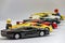 Focus-stacking with Lego figures next to a row of toy cars partly out of focus