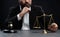 Focus symbols of justice on blurred background of lawyer. equility