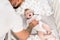 Focus of tattooed man touching infant