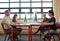 Focus is their secret to getting ahead. a group of businesspeople working on computers in a modern office.