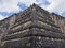 Focus on tomb of the High Priest pyramid at Chichen Itza mayan town at Mexico